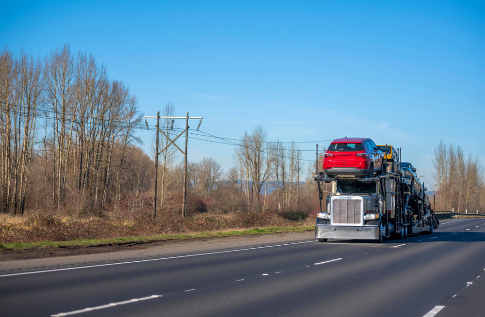 Car Being Loaded Onto A Transport Trailer